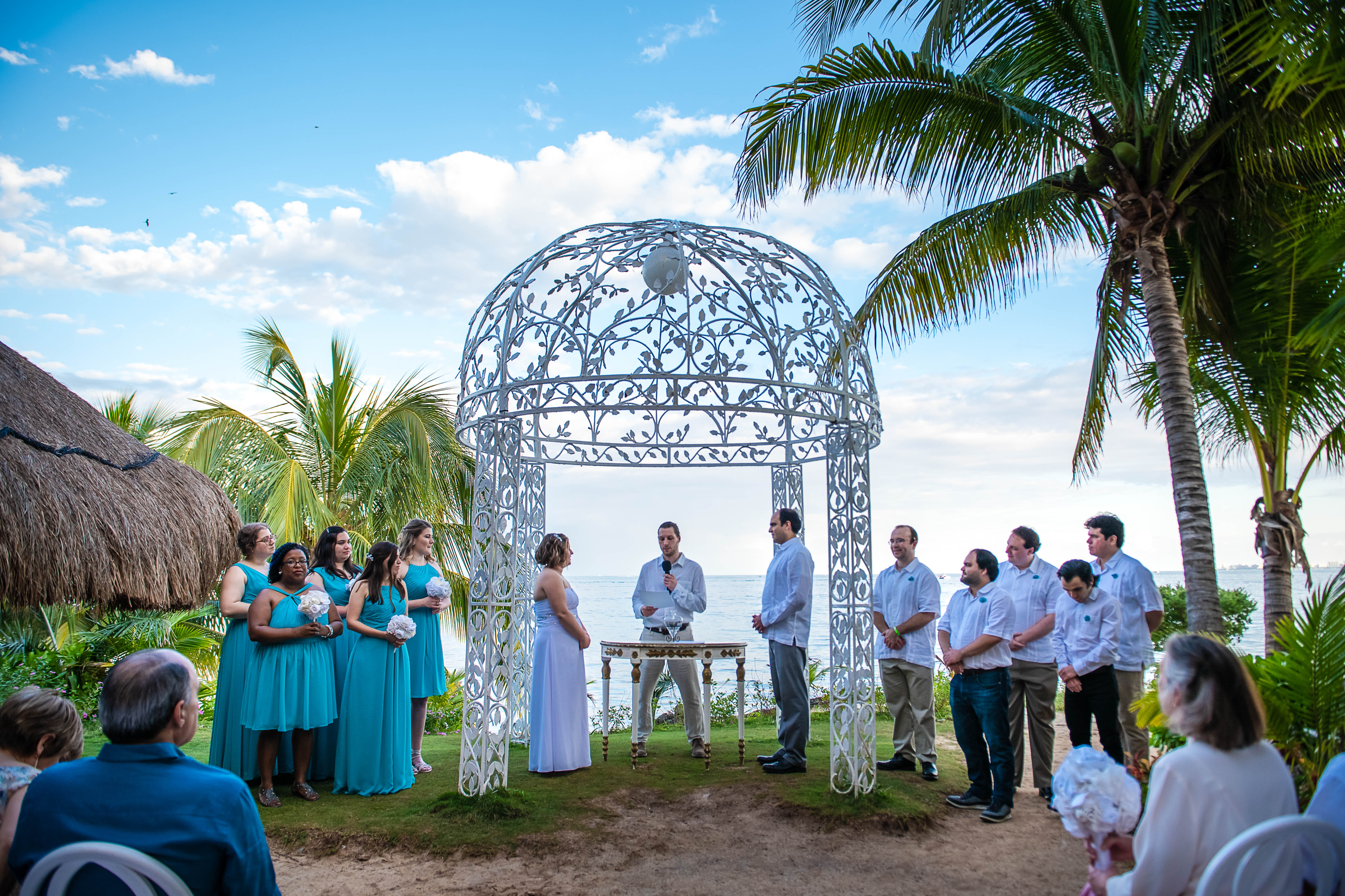 bride & groom during their ceremony looking to each other in Ocean Events at Puerto Juarez Quintana Roo Mexico